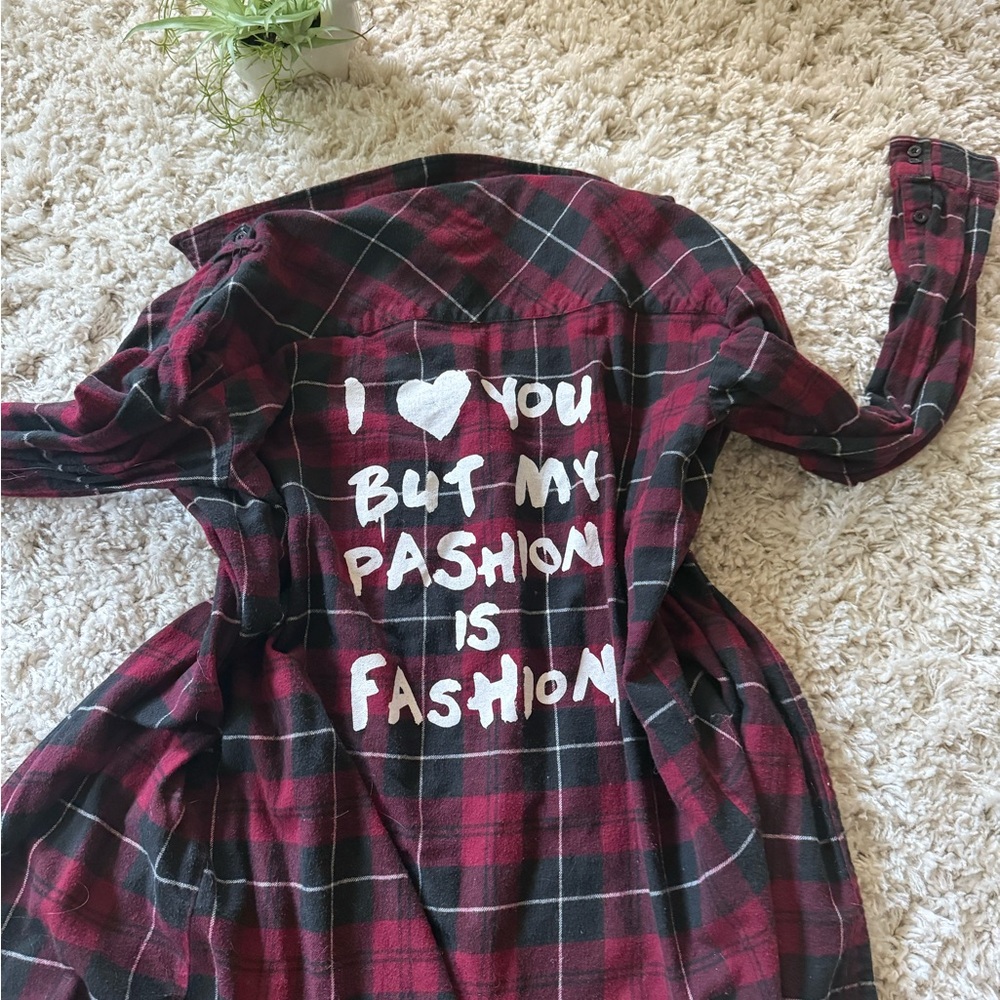 Red and Black Plaid Shirt with Graphic Text